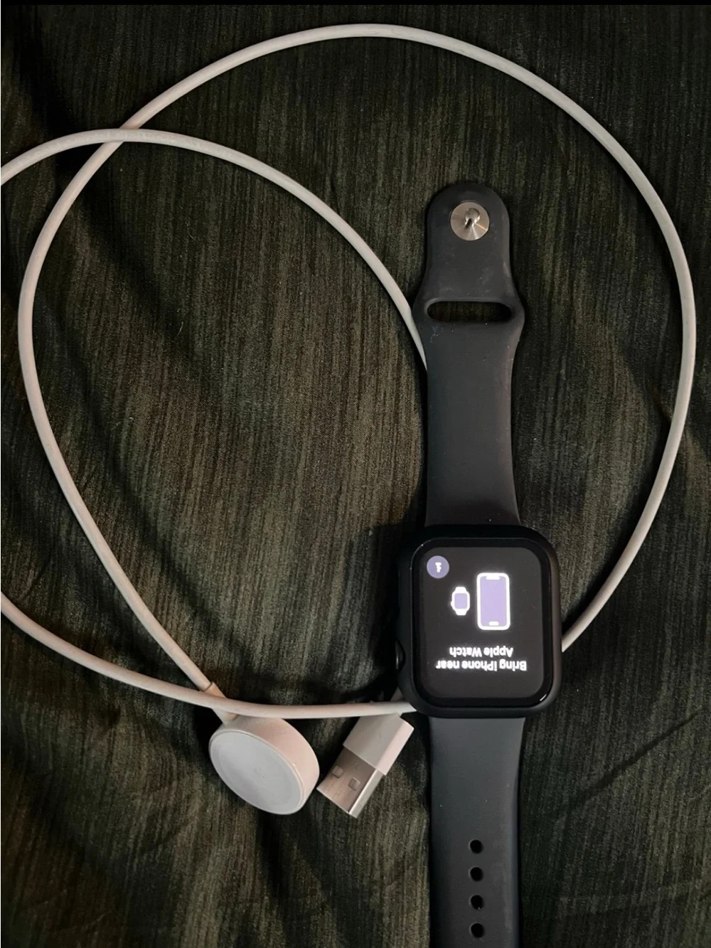 Apple Watch in black with black sport band